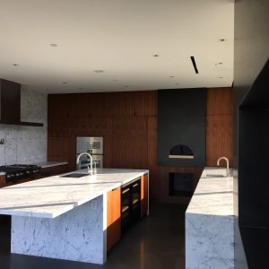 Kitchen Cabinets with Pizza Oven and TV Wall